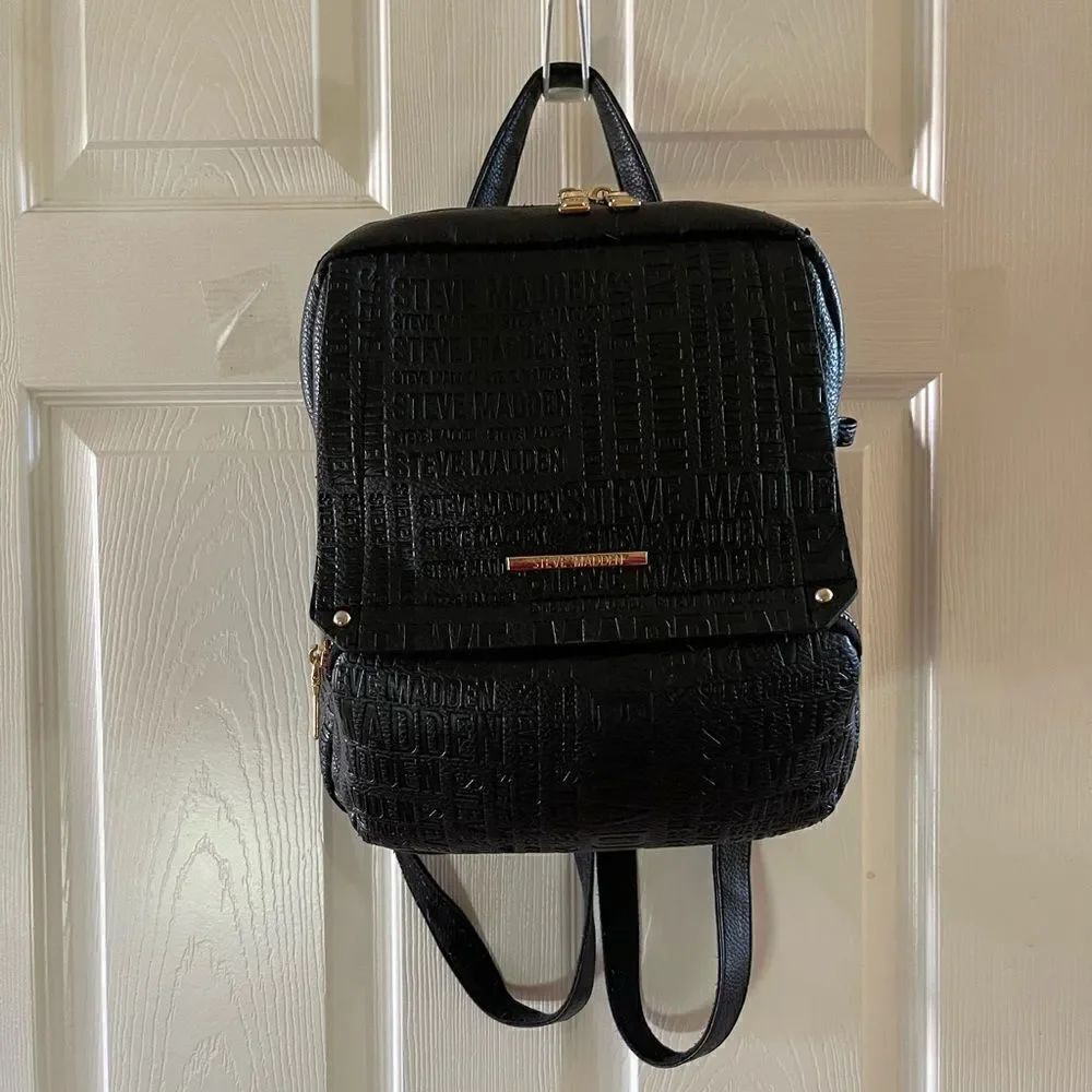 Steve Madden Black synthetic embossed small backpack gold tone hardwares.